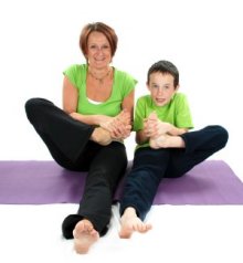 Mum and son enjoy a family yoga session